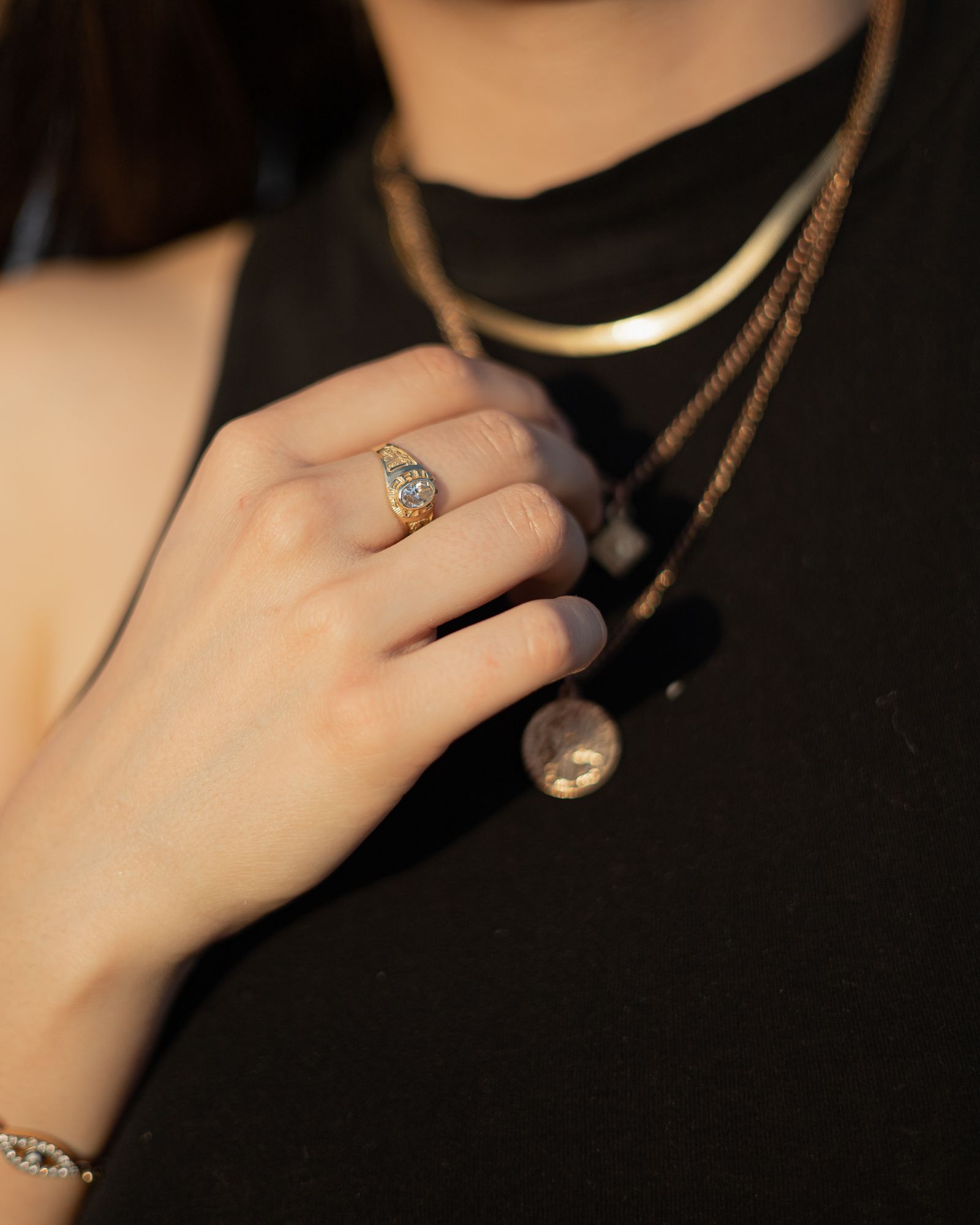 Jewelry styling inspiration with layered gold-tone necklaces